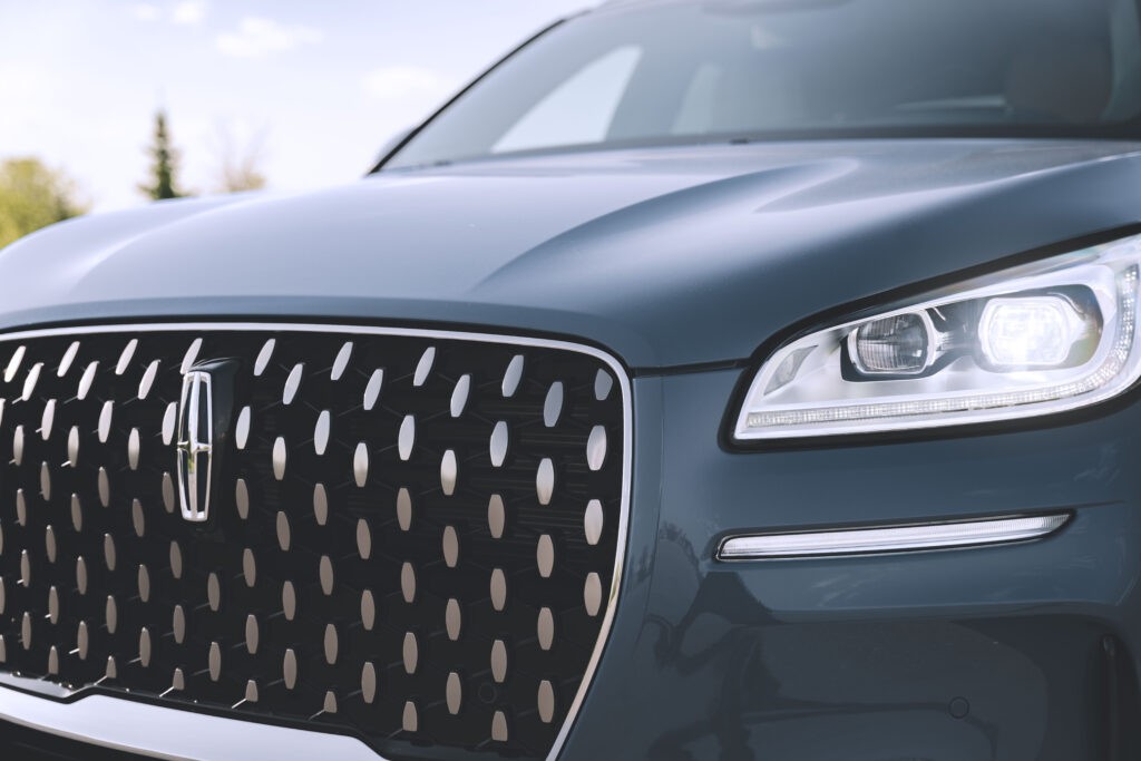 Classic Lincoln Navigator parked showcasing its front grille and headlights