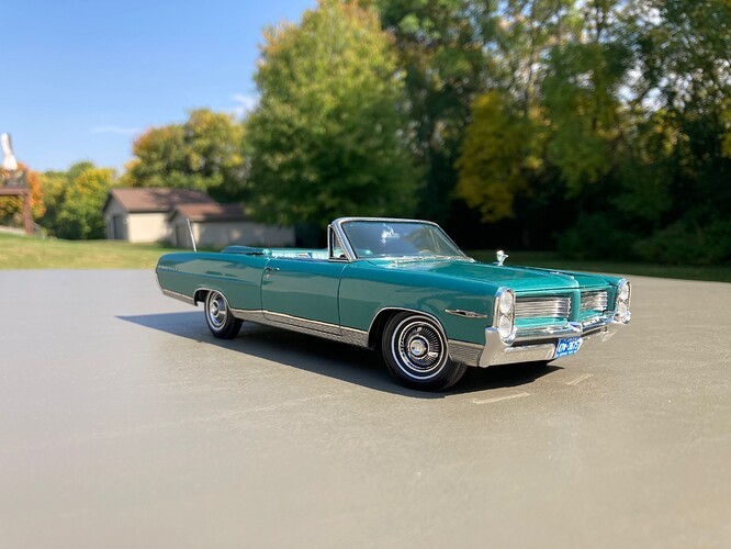 Detailed weathering on the chassis and undercarriage of the 1964 Pontiac Bonneville model car, showcasing realistic wear and tear.