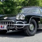 Front view of a black 1960 Corvette Big Brake Fuelie showcasing its iconic grille and headlights